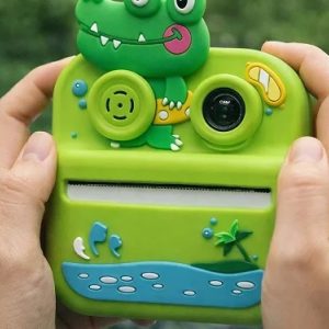 Detalj instant štampe na termalnom papiru — fotoaparat za decu krokodil