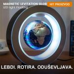 Levitirajući globus koji lebdi iznad magnetne baze na radnom stolu