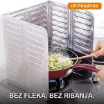 Aluminijumska zaštita od prskanja ulja postavljena uz šporet tokom kuvanja